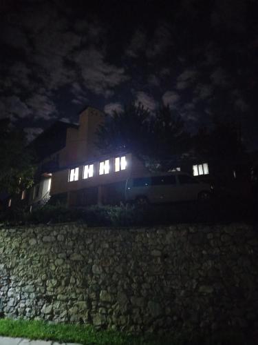 a car parked in front of a building at night at Spardishi tower in Mestia