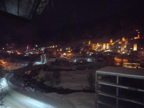 a view of a city at night with lights at Spardishi tower in Mestia