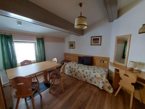 Fotografie z fotogalerie ubytování DOLOMITI appart&rooms v destinaci Varena