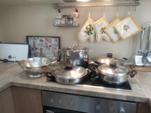 a group of pots and pans on a stove in a kitchen at IOANNIS SEASIDE VILLA in Leptokarya