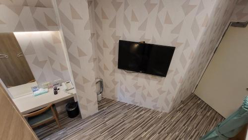 Televisyen dan/atau pusat hiburan di 寓旅宿 Apato Cityhome