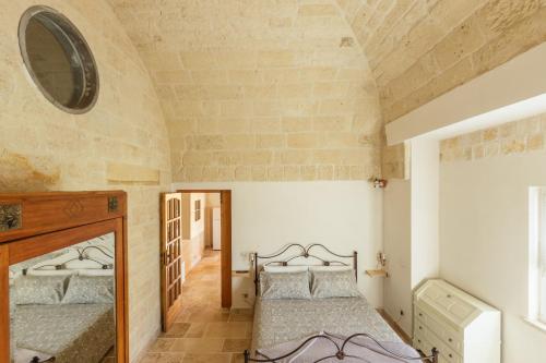 Una cama o camas en una habitación de Casolare Lodedo