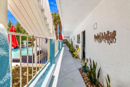 a building with a mural of horses on the side of it at Inn at Palm Springs in Palm Springs