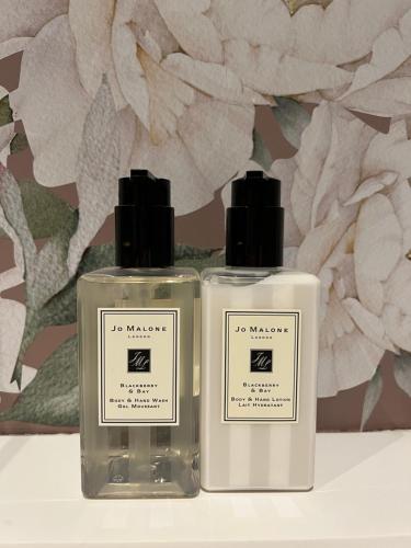 two bottles of soap sitting next to each other at Ailim House Serviced Cottage Escape, around the corner from the Old Course in St. Andrews