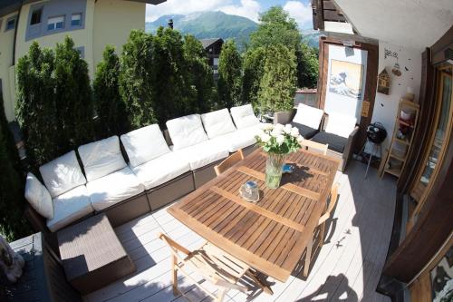 a living room with a couch and a table at Wengen Lauberhorn - Flat available in Wengen