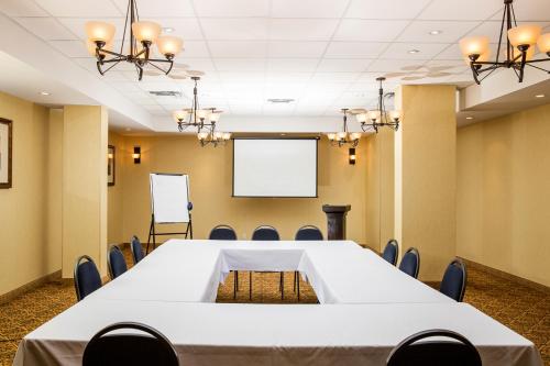 a conference room with a table and chairs at Days Inn by Wyndham Edmonton Downtown in Edmonton
