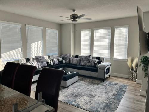 a living room with a couch and a table at New 3 story home *Seaworld/ Lackland in Helotes