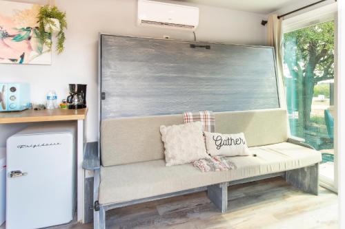 a bench in a room with a large window at The Container Retreat at 290 Wine Trail #2 Adventure awaits! in Hye