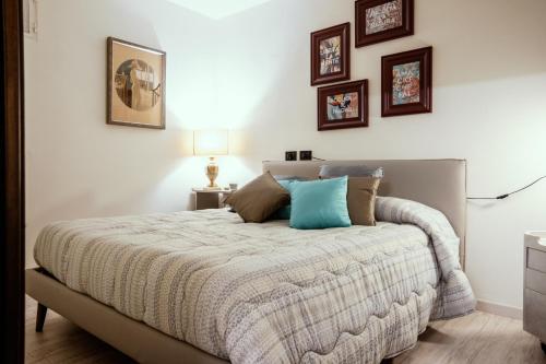 a bedroom with a bed with pillows on it at Un posto davvero unico! in Marone