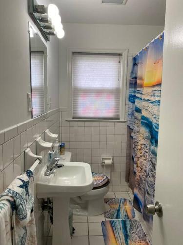 a bathroom with a sink and a toilet at Fabulous Family Rancher ! Ocean City NJ Beaches in Somers Point