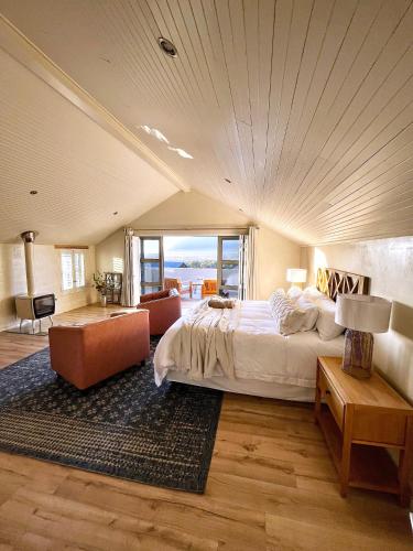 a large bedroom with a bed and a large window at No2 Merlot in Cape Town