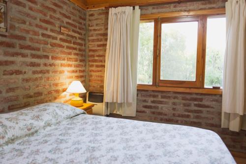 Postel nebo postele na pokoji v ubytování cabaña ASSISI