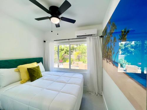 a bedroom with a bed and a ceiling fan at 3 Seasons at the Carrington 3 Two Bedroom 1 Bath Apts -6 Bedrooms 3 bathrooms and 3 bedroom 2 bathroom Villa in Miami
