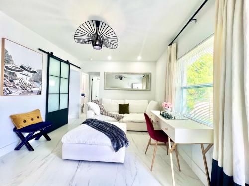 a bedroom with a bed and a desk at 3 Seasons at the Carrington 3 Two Bedroom 1 Bath Apts -6 Bedrooms 3 bathrooms and 3 bedroom 2 bathroom Villa in Miami