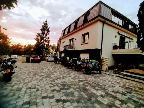 a building with motorcycles parked in front of it at Chemin des Vignerons in Metz