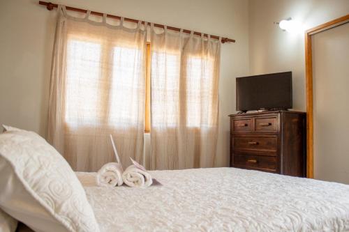 Postel nebo postele na pokoji v ubytování Origenes Spa & Lodging
