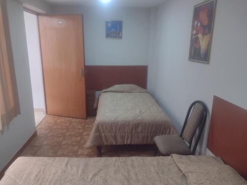 a hospital room with a bed and a chair at Casa de Isabel in Arequipa