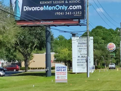 a sign for a drug store in a parking lot at Roosevelt Inn in Jacksonville