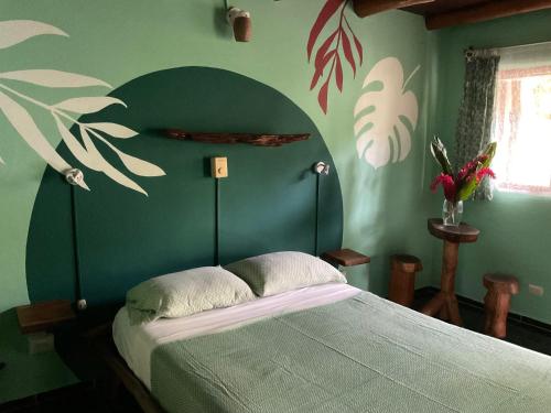 Una cama o camas en una habitación de Hotel Entre Dos Aguas