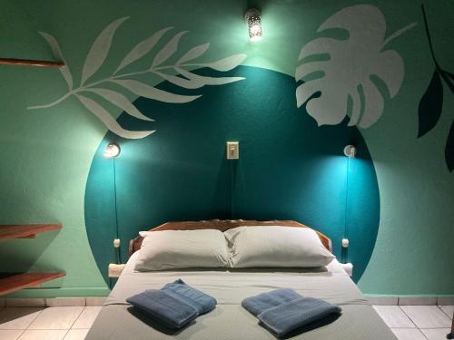 Una cama o camas en una habitación de Hotel Entre Dos Aguas