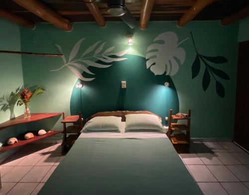 Una cama o camas en una habitación de Hotel Entre Dos Aguas