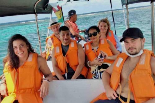 a group of people in orange life jackets on a boat at Private Cabin in San Blas Islands - Include meals in Waisalatupo