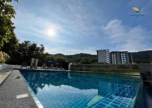 a swimming pool on the roof of a building at Bahang Bay Hotel in Batu Ferringhi