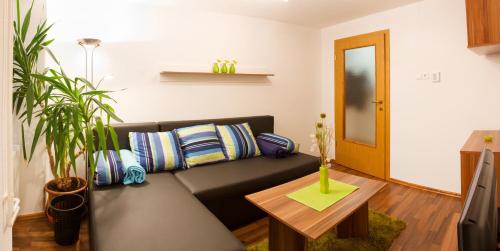 a living room with a couch and a table at Apartments Shock in Cerkno