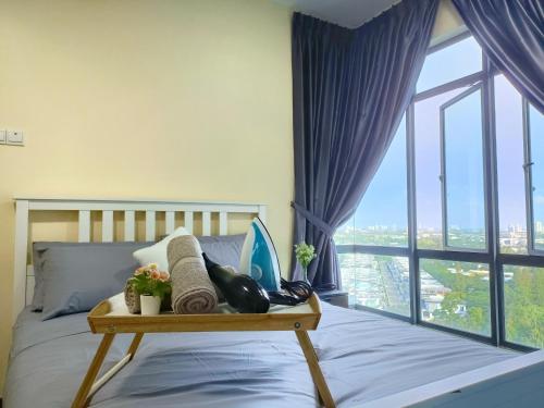 a bedroom with a bed with a large window at ARC Austin Hills Residensi by Antlerzone in Johor Bahru