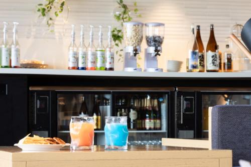 a bar with two cocktails on a counter at THE CHELSEA BREATH in Takamatsu