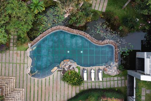 an overhead view of a swimming pool in a yard at SpiceTree Rajakumari in Munnar
