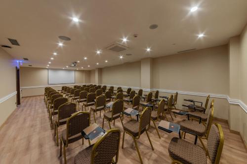 a conference room with chairs and a podium in it at Mukarnas Pera Hotel in Istanbul