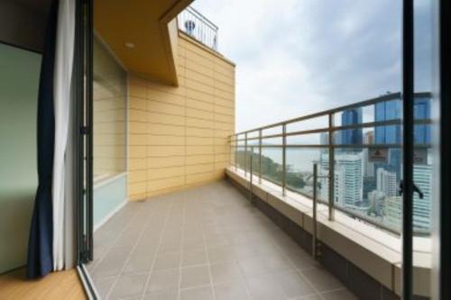 a balcony of a building with a view of the city at Kwangsu Hotel Haeundae in Busan