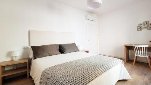 Ένα ή περισσότερα κρεβάτια σε δωμάτιο στο Parador 10 Apartamentos