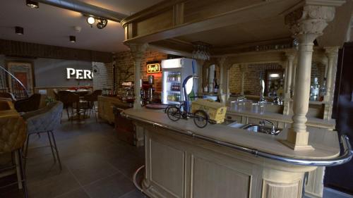 a bar in a restaurant with a bike on the counter at VET - Bed & Breakfast in Beek