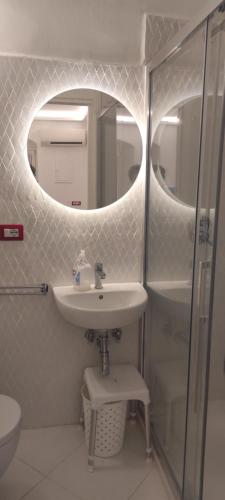 a bathroom with a sink and a mirror at SANT 'ANDREA'S Apartment in Amalfi