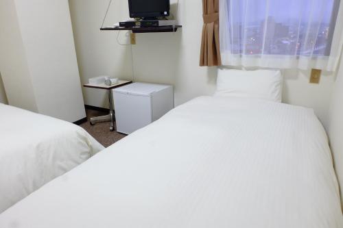 Ένα ή περισσότερα κρεβάτια σε δωμάτιο στο Tabist Hotel Tetora Hakodate Station