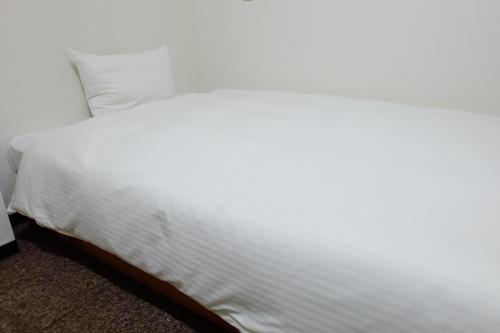 Ένα ή περισσότερα κρεβάτια σε δωμάτιο στο Tabist Hotel Tetora Hakodate Station