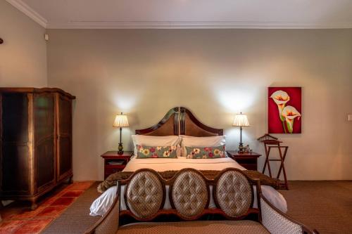 Katil atau katil-katil dalam bilik di Mooiplaas Guesthouse
