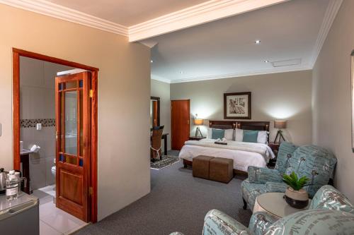 Katil atau katil-katil dalam bilik di Mooiplaas Guesthouse