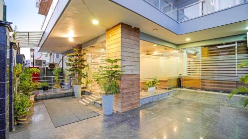 a house with a pool and plants in it at The Palm Suites - Medicity in Gurgaon