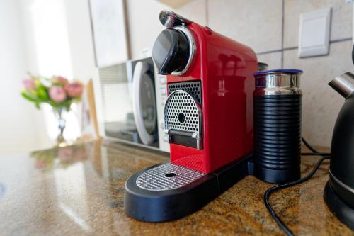 a red appliance sitting on top of a counter at Klein Sterretjie in Paternoster
