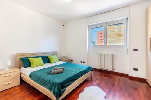 a bedroom with a bed and a window at Appartamento Bicocca - Affitti Brevi Italia in Milan