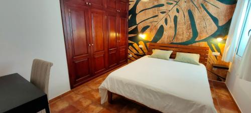 A bed or beds in a room at Villa Fedelian 2 Playa Blanca