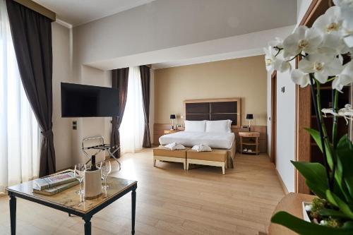 Postel nebo postele na pokoji v ubytování Hotel Astoria