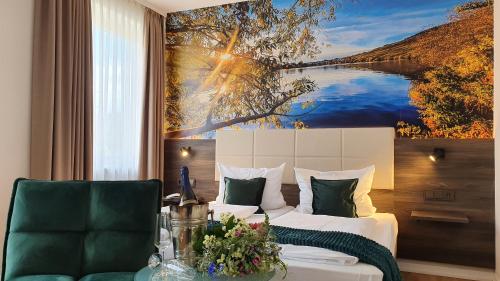 a hotel room with a bed and a painting on the wall at Hotel "Zum Moseltal" in Mehring