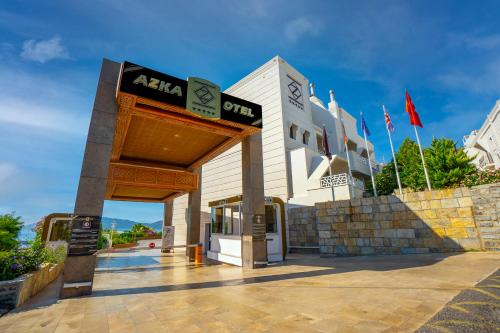 a building with a sign in front of it at Azka Hotel in Bodrum City