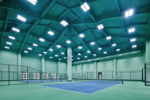 a tennis court in a building with lights on it at Howard Johnson Agile Plaza Chengdu in Chengdu