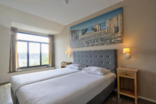 Ένα ή περισσότερα κρεβάτια σε δωμάτιο στο Residence Wijngaerde - Baddomburg