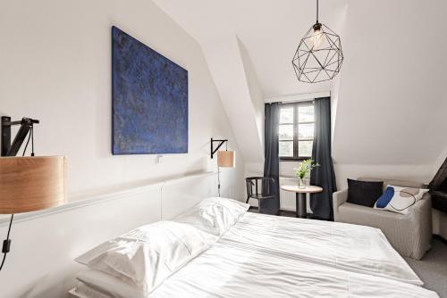 Una cama o camas en una habitación de Hotel Pivoňka